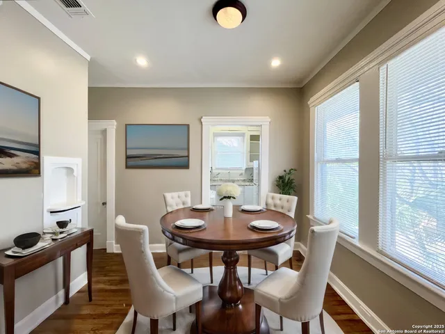 a view of a dining room with furniture window and outside view