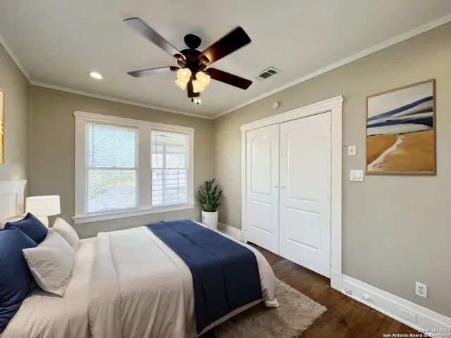 a spacious bedroom with a large bed and a window