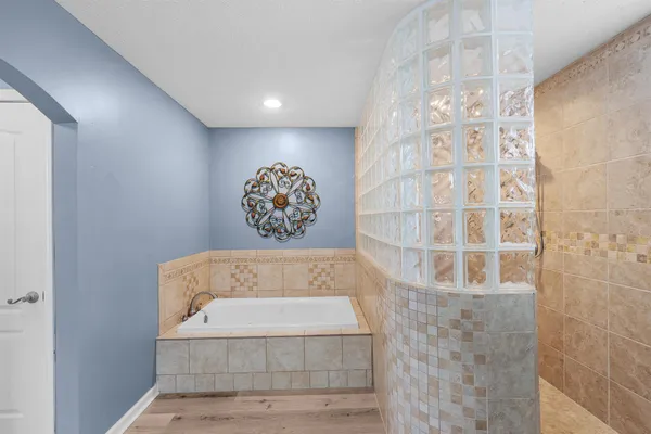 a view of a hallway with paintings on the wall