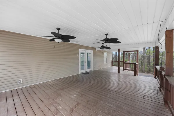 a view of livingroom with hardwood floor and ceiling fan