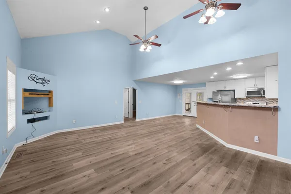 a view of a livingroom with a kitchen