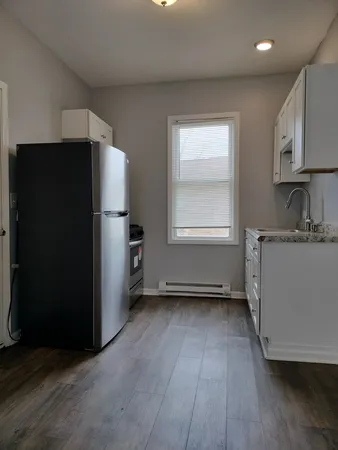 a bathroom with a toilet a sink and bathtub