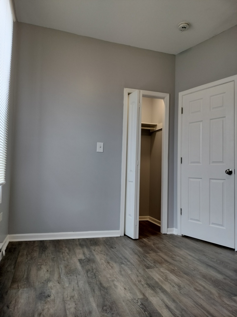 6601 South Green Street, Unit 8232 Chicago, IL 60621 - Photo 4 of 12 a view of an empty room and closet area