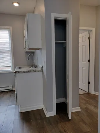 a room with a sink and a mirror