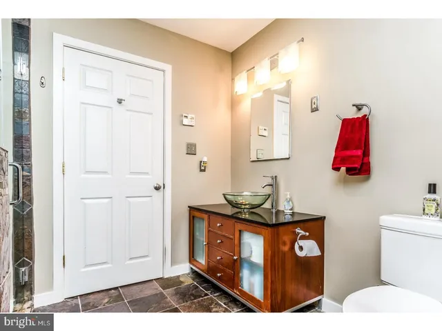 a bathroom with a toilet and a sink