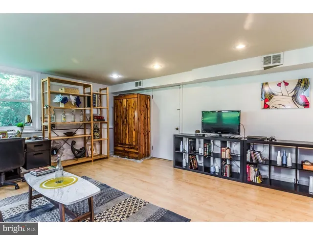 a room with furniture and a flat screen tv