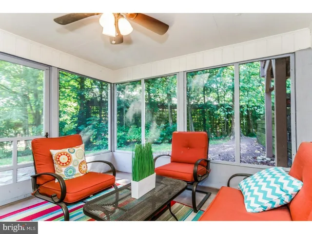 a outdoor living space with furniture and a floor to ceiling window