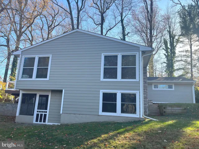 a view of house with yard