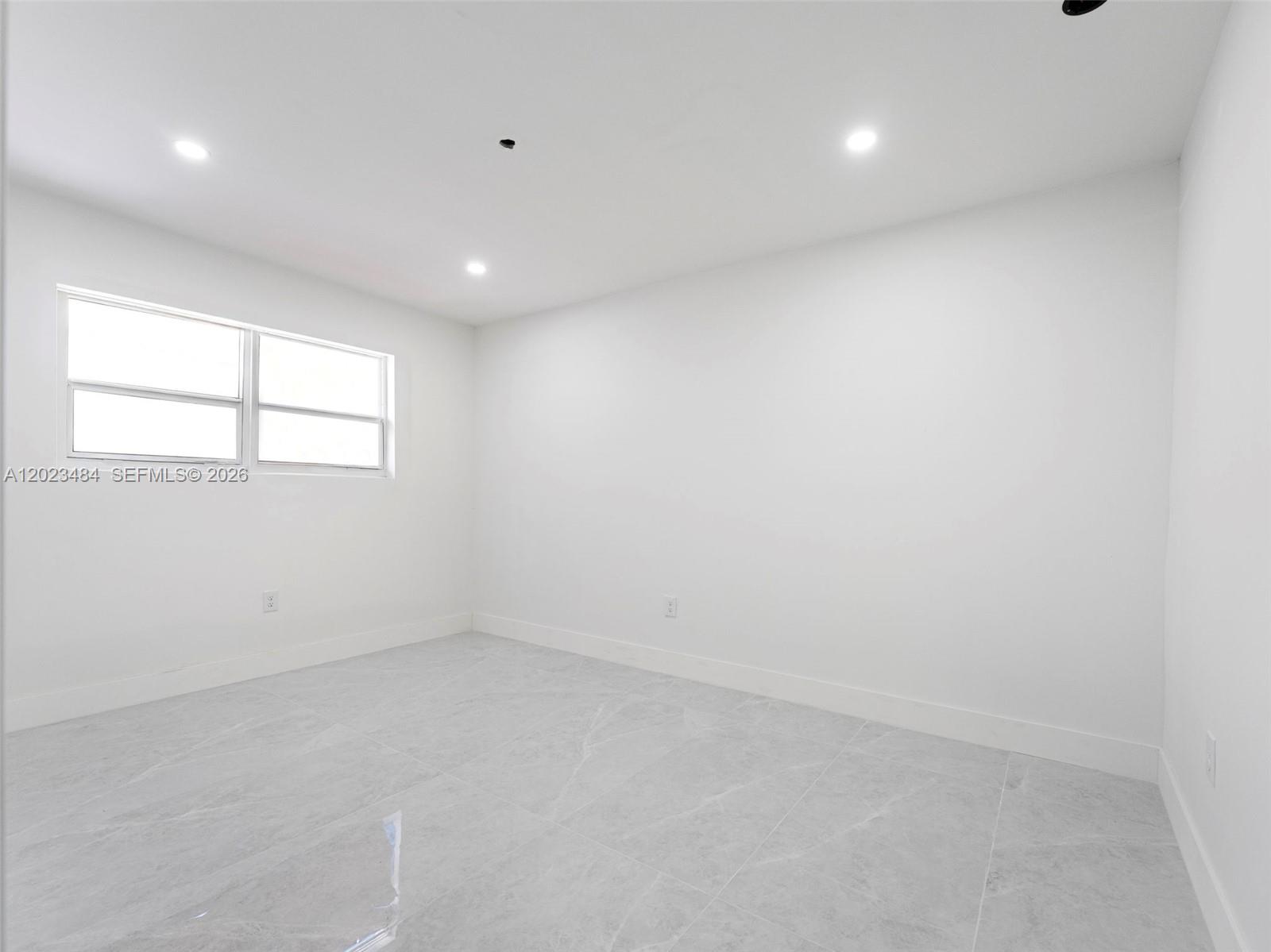 1961 Rutland Street Opa-Locka, FL 33054 - Photo 14 of 33 an empty room with windows