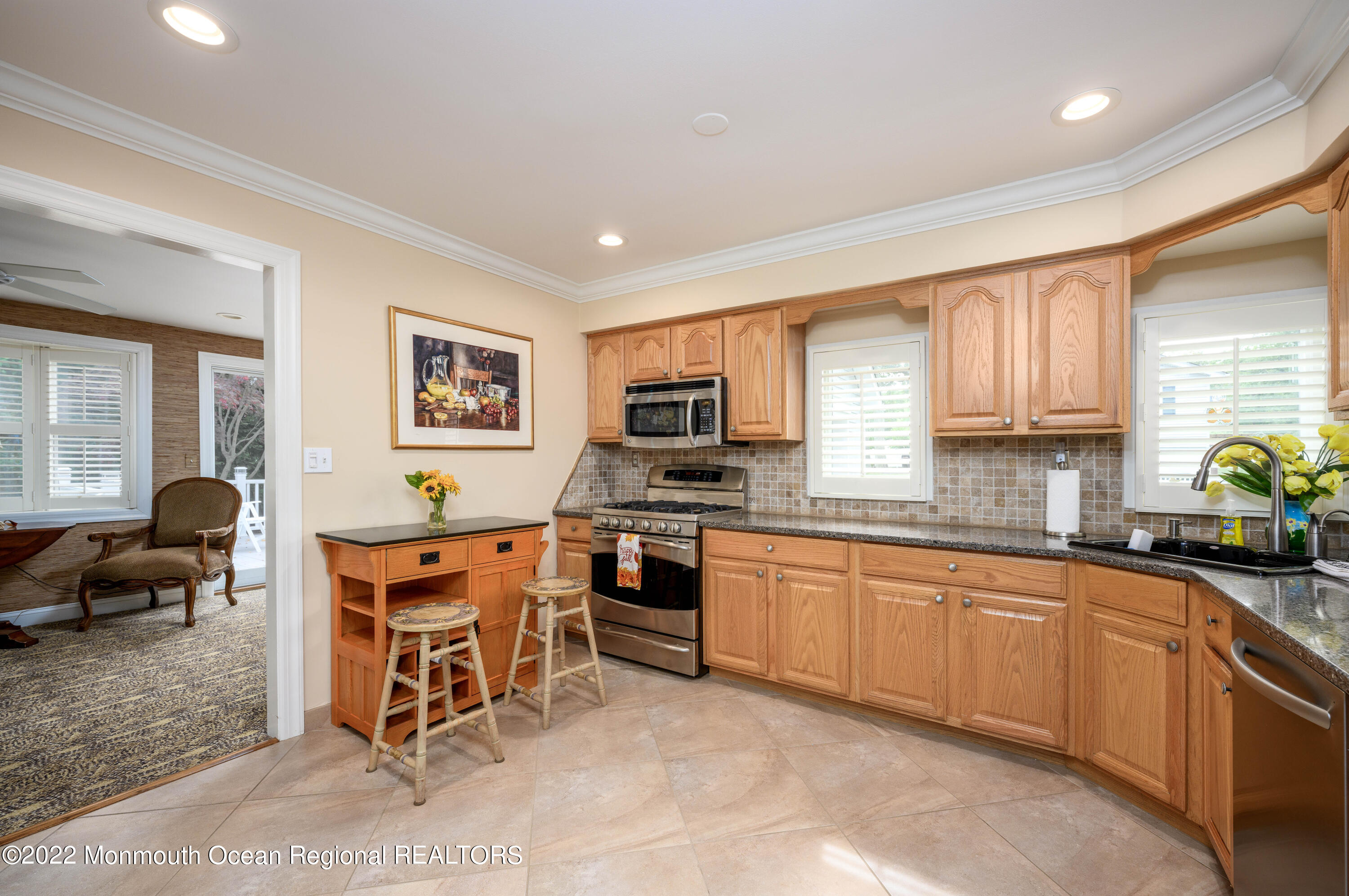 2002 Nassau Drive Spring Lake, NJ 07762 - Photo 12 of 43 a kitchen with stainless steel appliances granite countertop sink stove top oven and cabinets