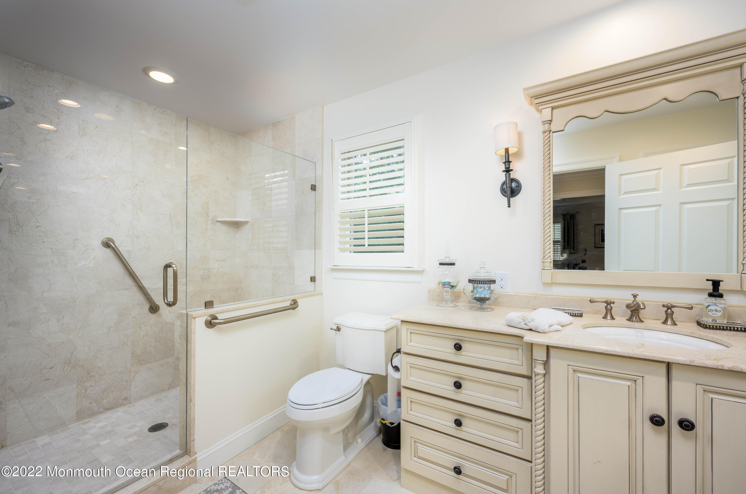 2002 Nassau Drive Spring Lake, NJ 07762 - Photo 21 of 43 a bathroom with a double vanity sink toilet mirror and shower