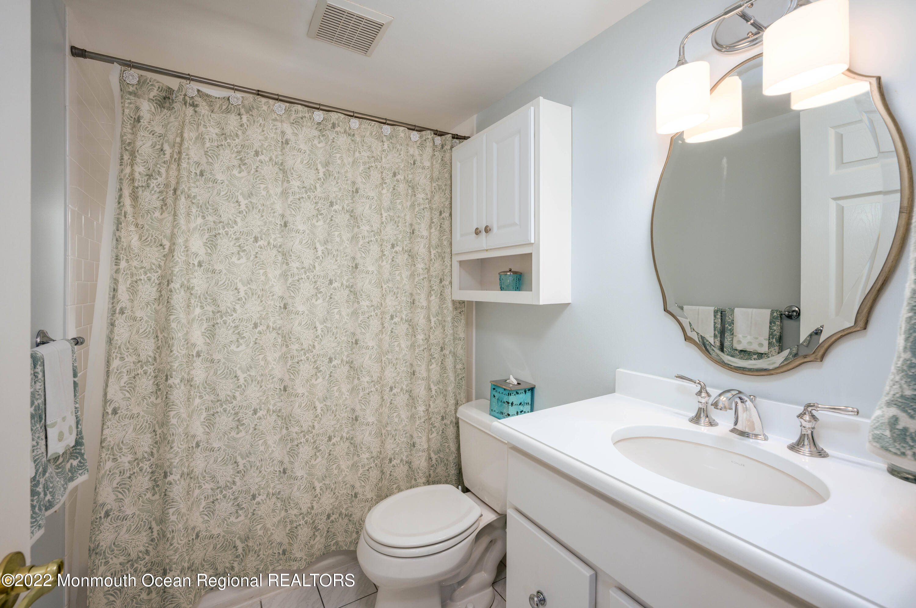 2002 Nassau Drive Spring Lake, NJ 07762 - Photo 23 of 43 a bathroom with a sink toilet and mirror
