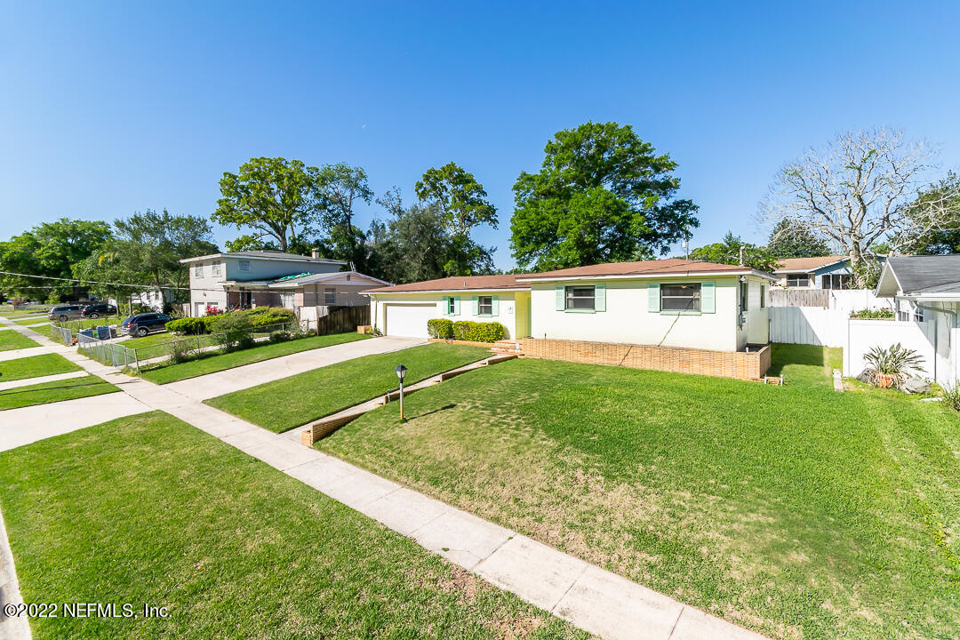 3846 Bess Road Jacksonville, FL 32277 - Photo 15 of 18 a view of a house with a yard porch and sitting area