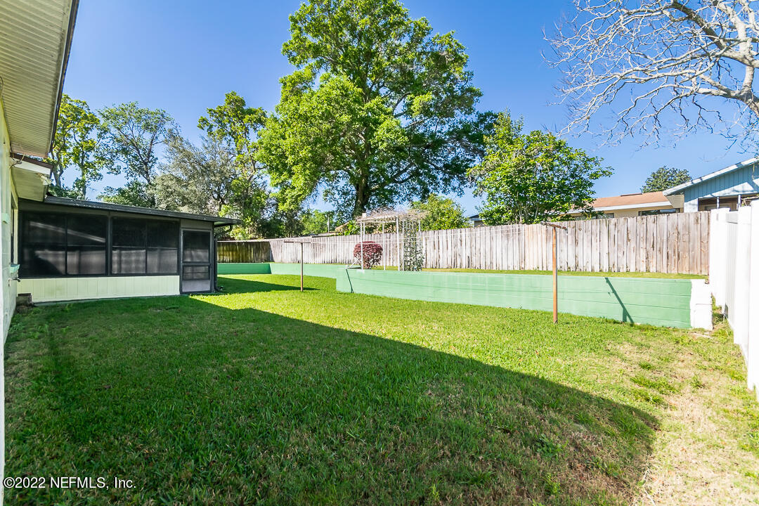 3846 Bess Road Jacksonville, FL 32277 - Photo 18 of 18 a view of a house with a backyard