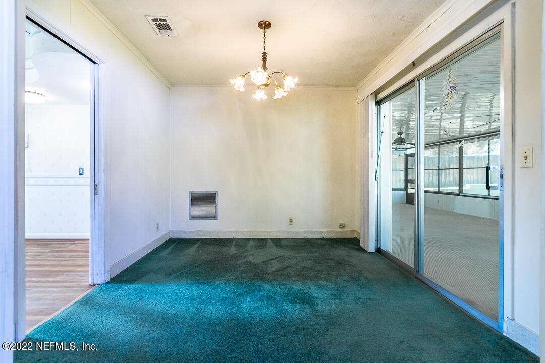 3846 Bess Road Jacksonville, FL 32277 - Photo 4 of 18 a view of an empty room with a window