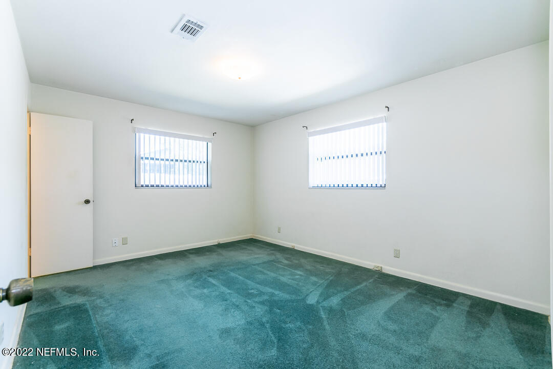 3846 Bess Road Jacksonville, FL 32277 - Photo 8 of 18 an empty room with a window