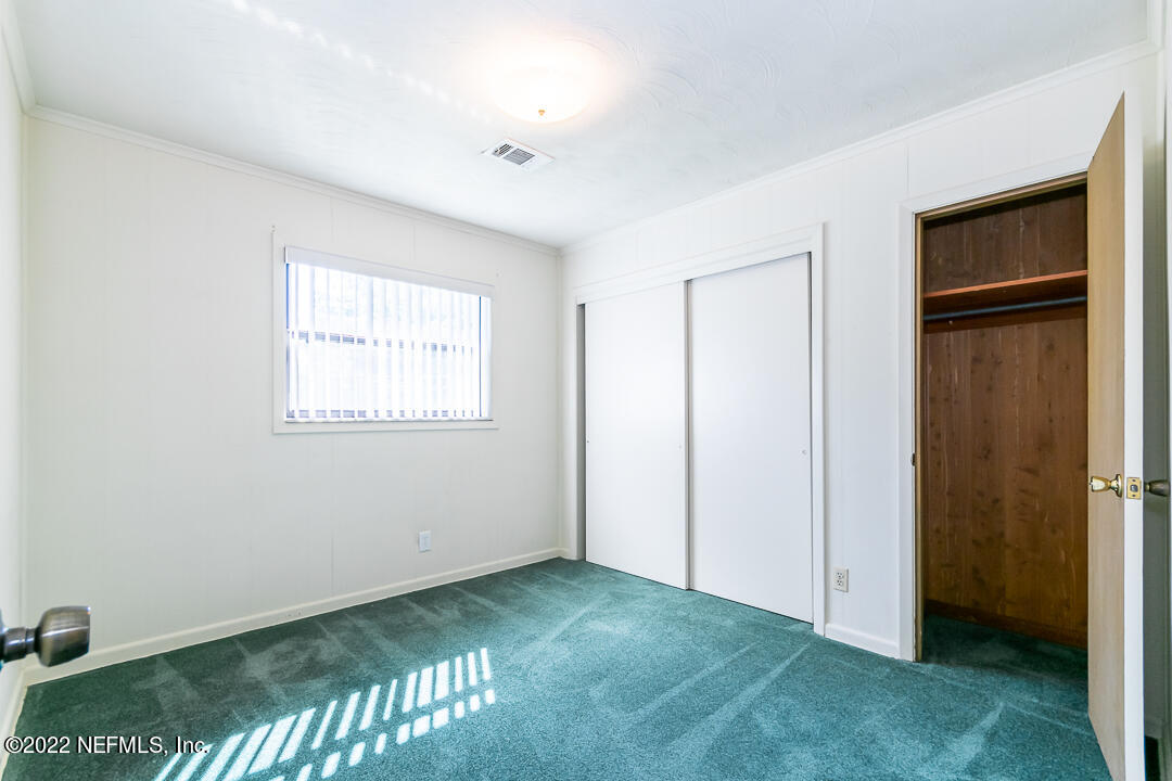 3846 Bess Road Jacksonville, FL 32277 - Photo 10 of 18 a view of an empty room with closet area