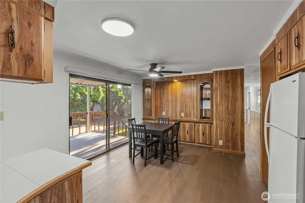 a view of a dining room with furniture window and outside view
