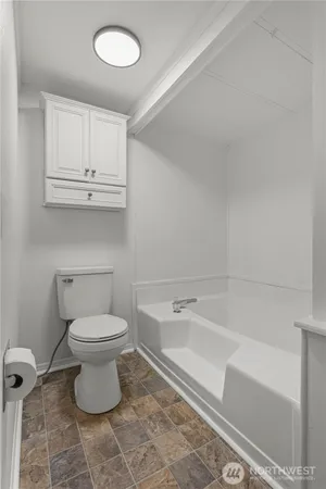 a bathroom with a toilet a sink and a bathtub