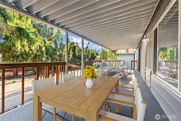 a view of a patio with wooden floor