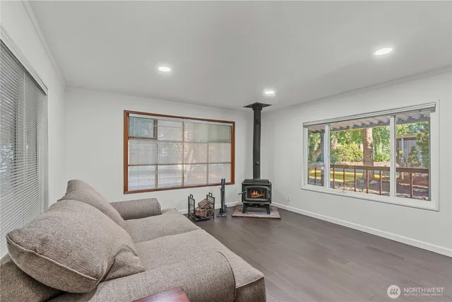 a spacious bedroom with a large bed and a large window