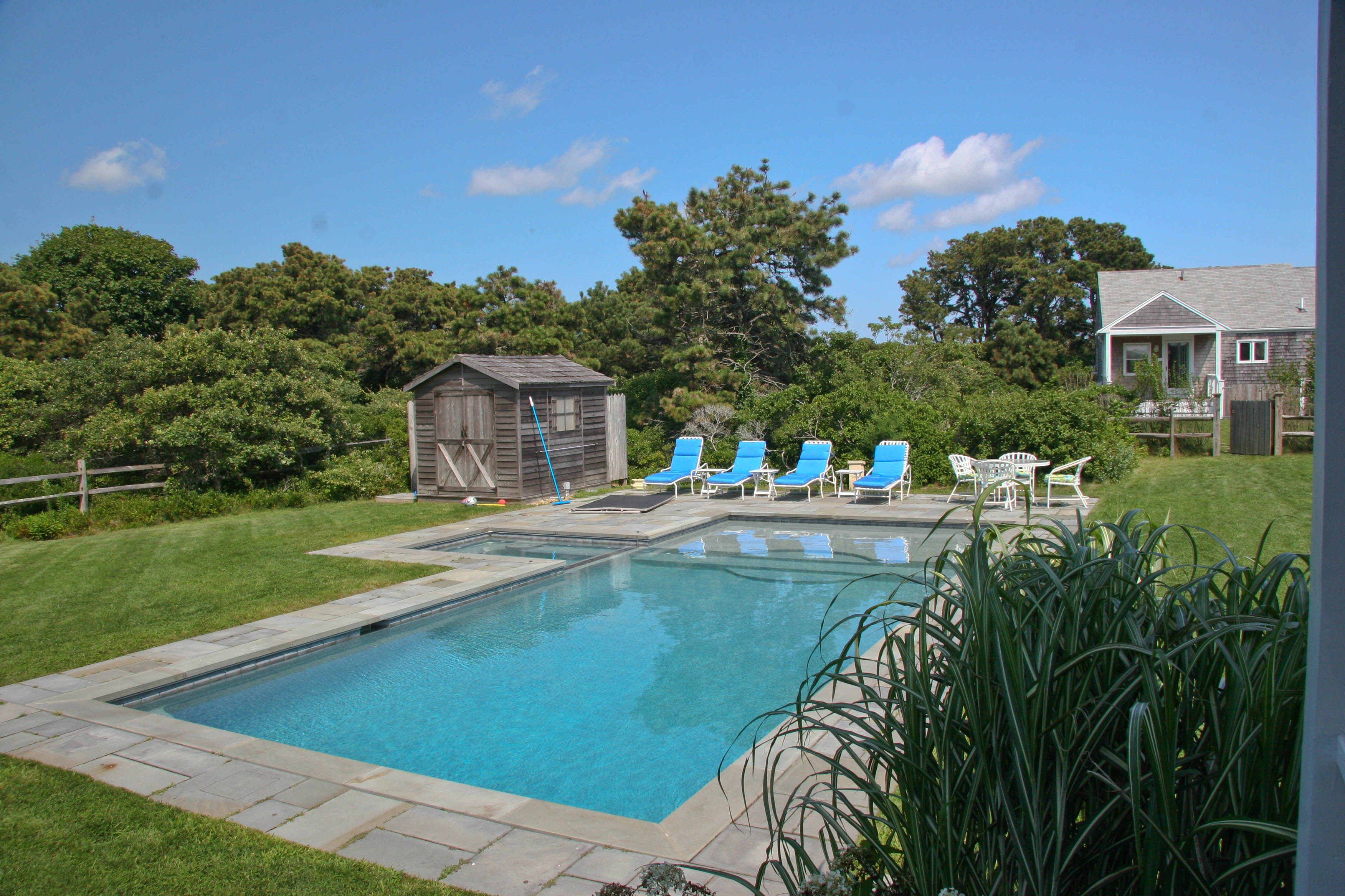 144 Surfside Road Nantucket, MA 02554 - Photo 33 of 46 a swimming pool with outdoor seating and yard