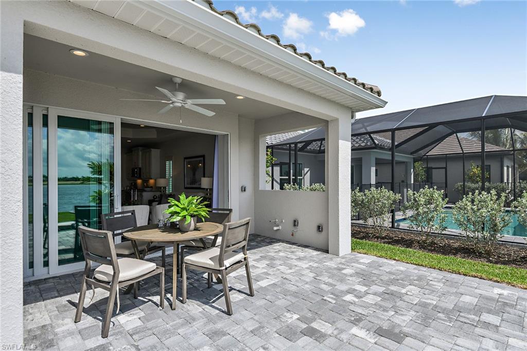 4621 Centaurus Circle Naples, FL 34120 - Photo 15 of 15 a view of a patio with furniture and garden