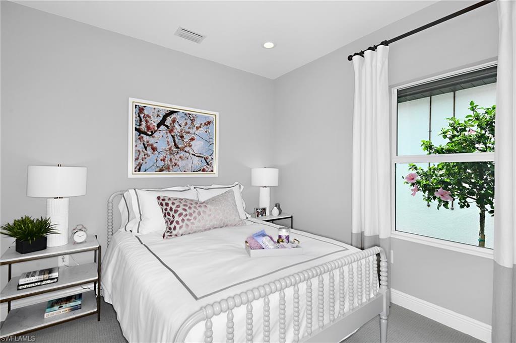 4621 Centaurus Circle Naples, FL 34120 - Photo 5 of 15 a bedroom with a bed and a painting on the wall