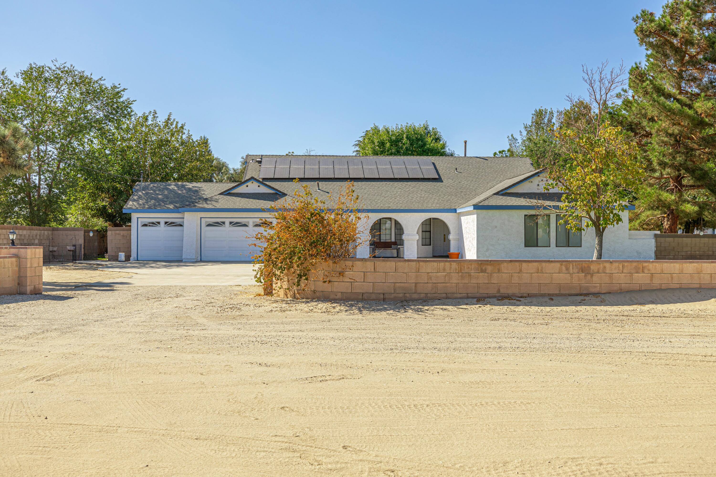 43233 55th Street East Lancaster, CA 93535 - Photo 1 of 46 a view of a house with a swimming pool