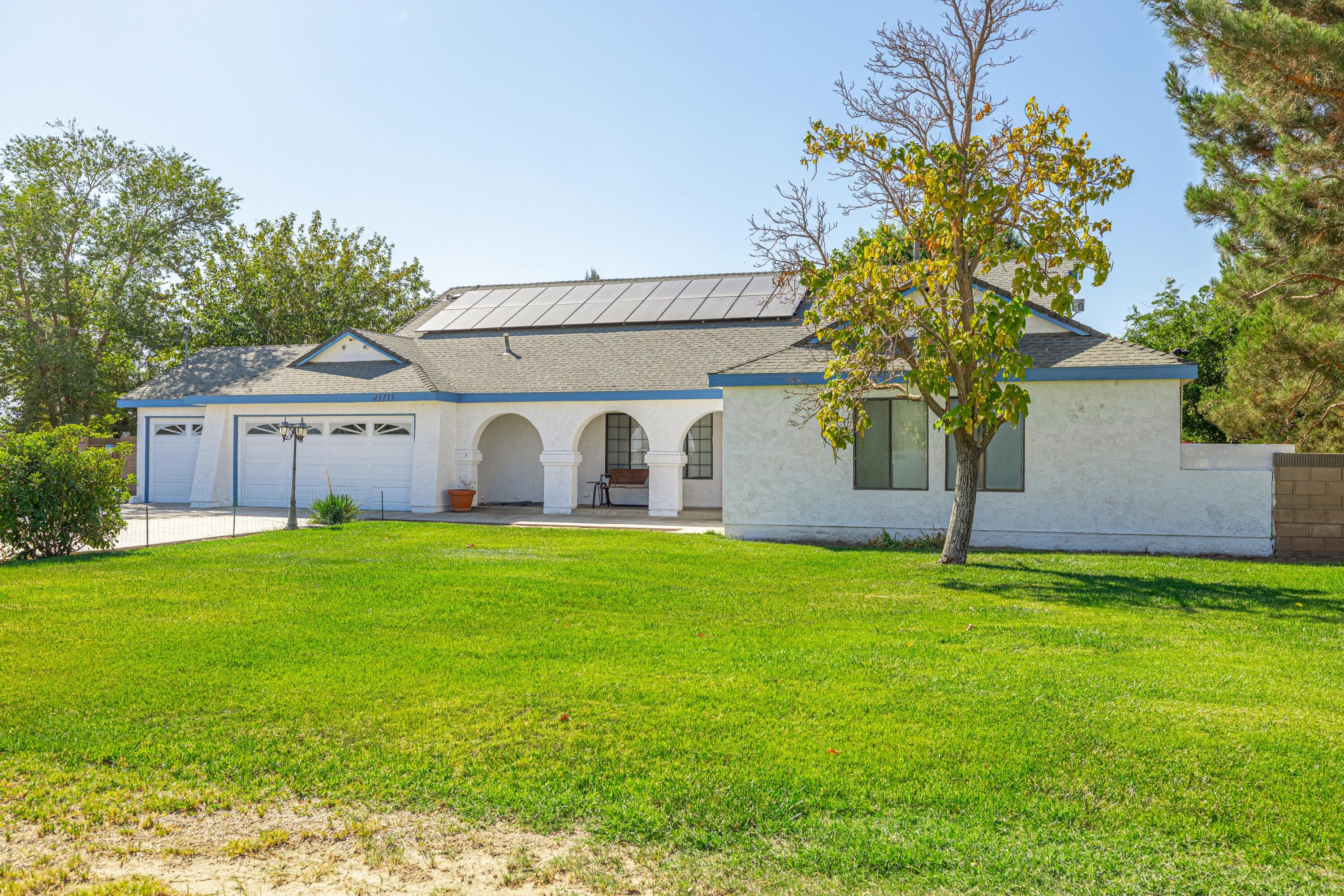 43233 55th Street East Lancaster, CA 93535 - Photo 2 of 46 a front view of house with garden