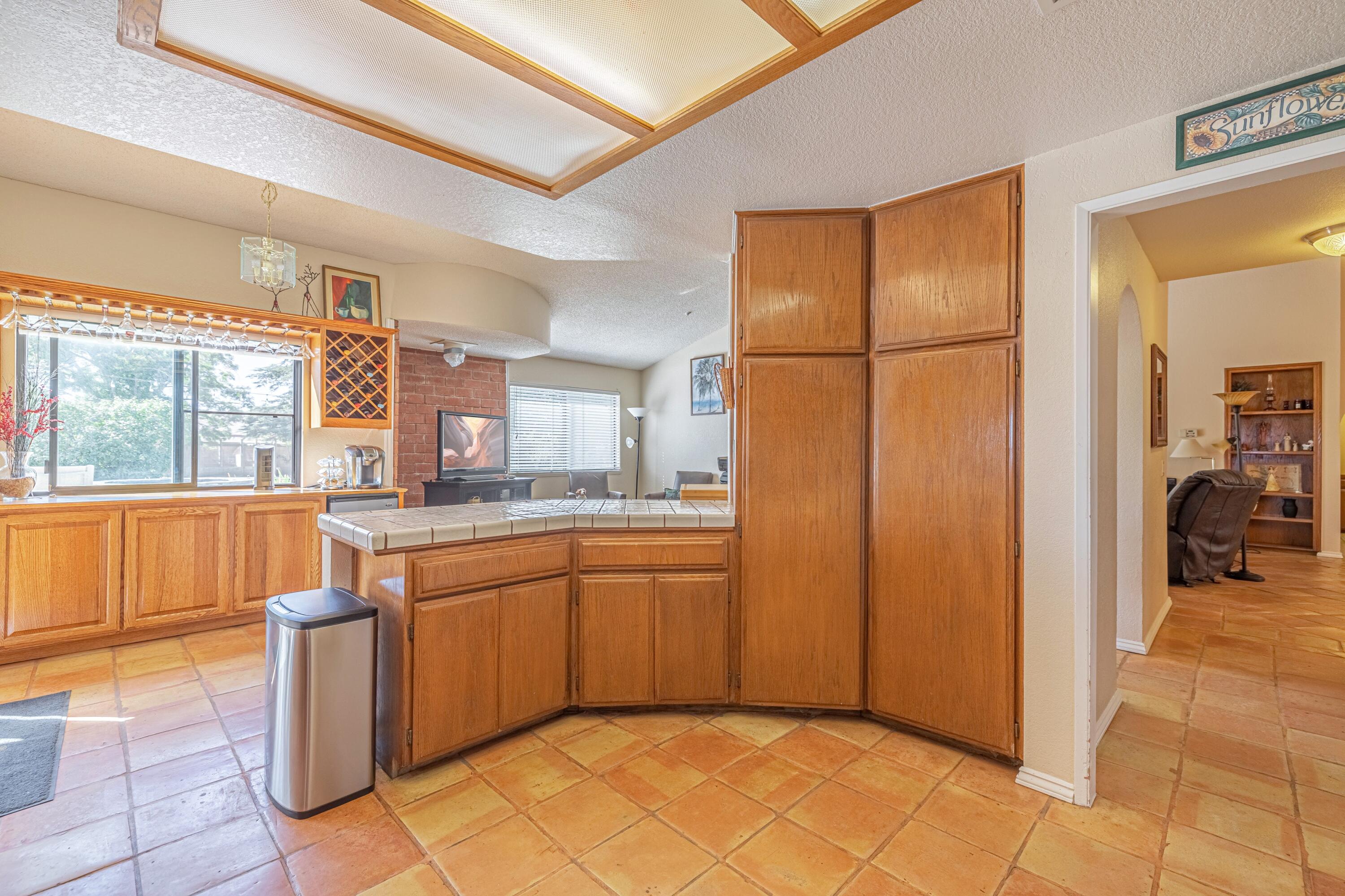 43233 55th Street East Lancaster, CA 93535 - Photo 14 of 46 a kitchen with a sink and a refrigerator