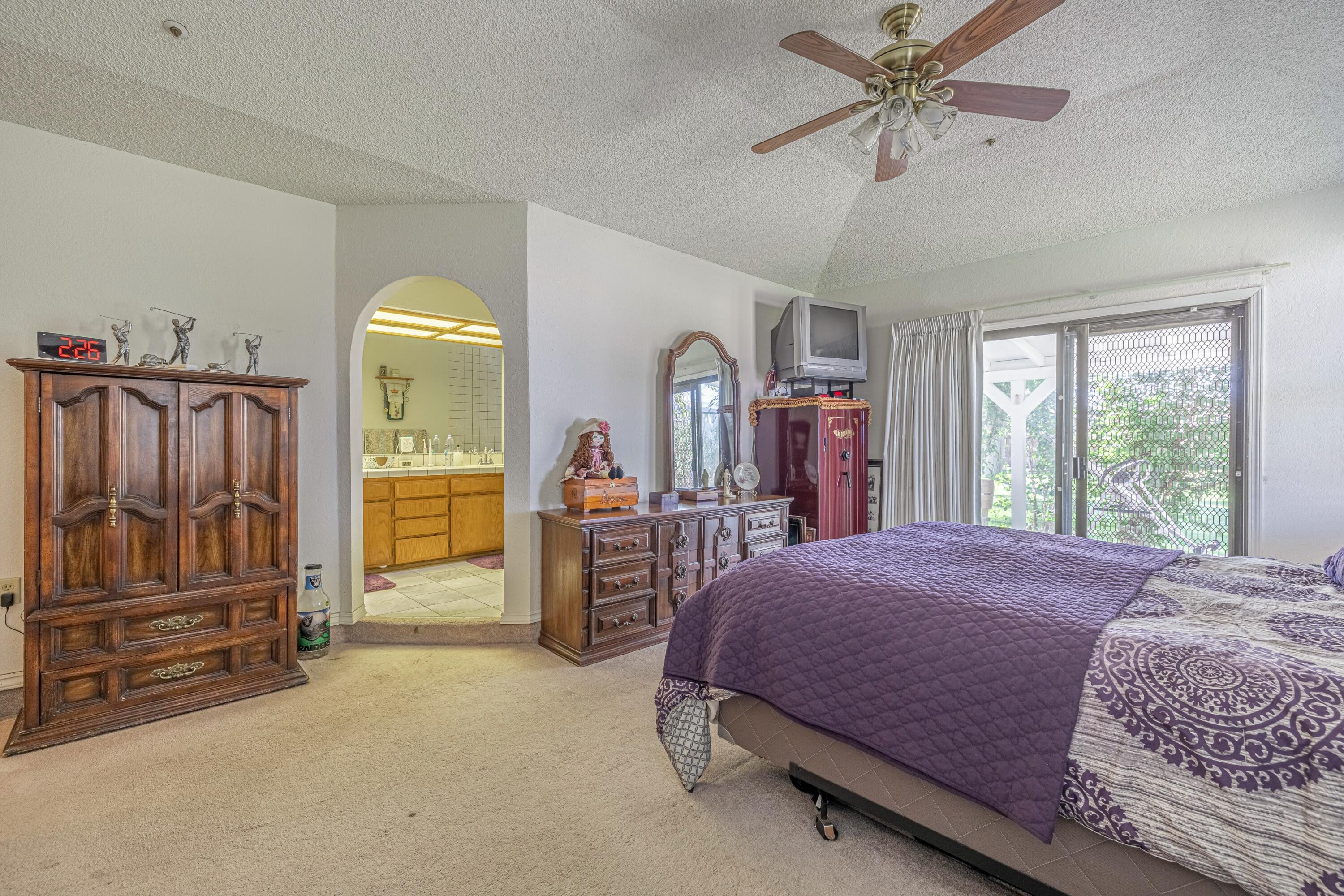 43233 55th Street East Lancaster, CA 93535 - Photo 20 of 46 a bedroom with a bed and large mirror