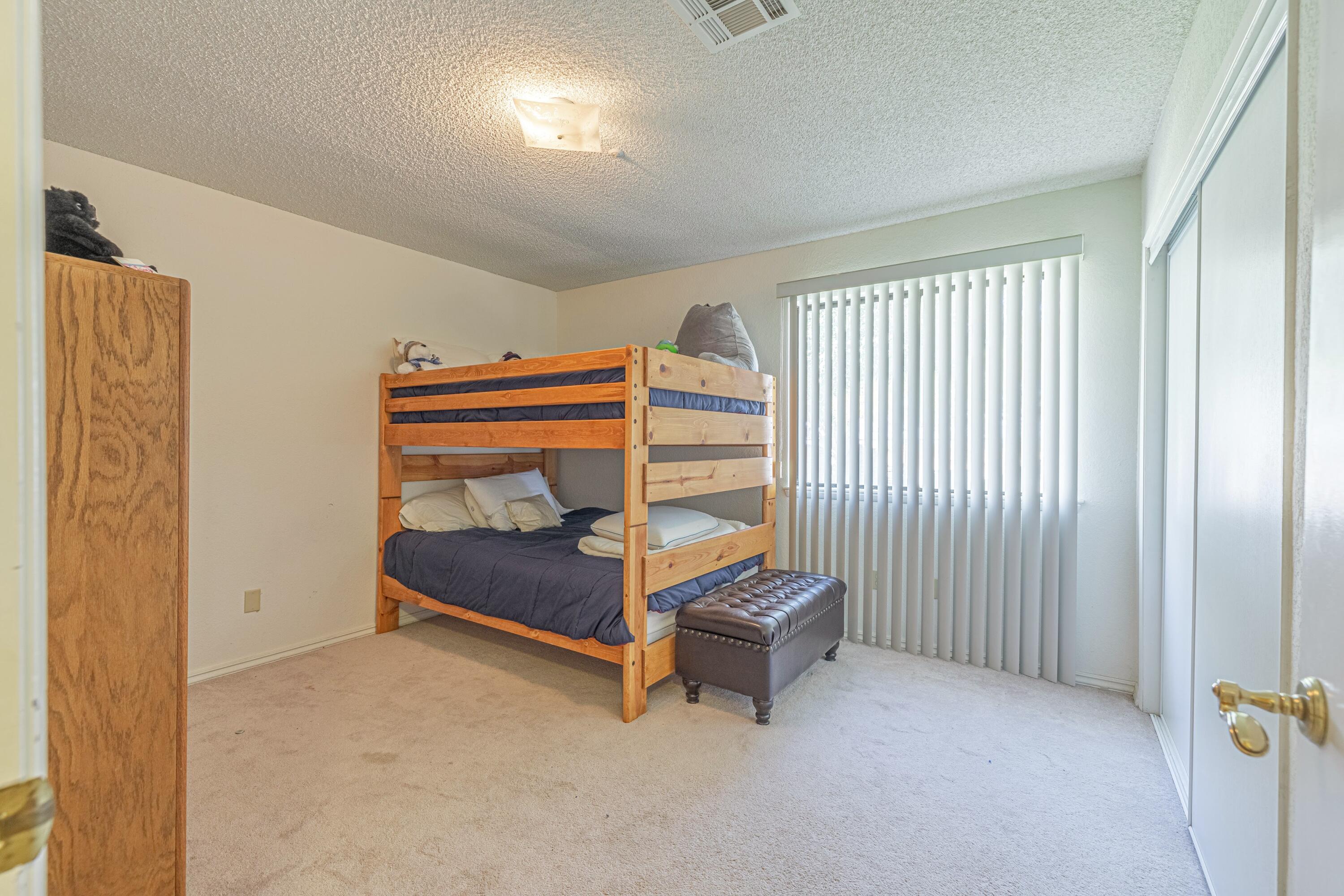 43233 55th Street East Lancaster, CA 93535 - Photo 24 of 46 a bedroom with furniture and a window
