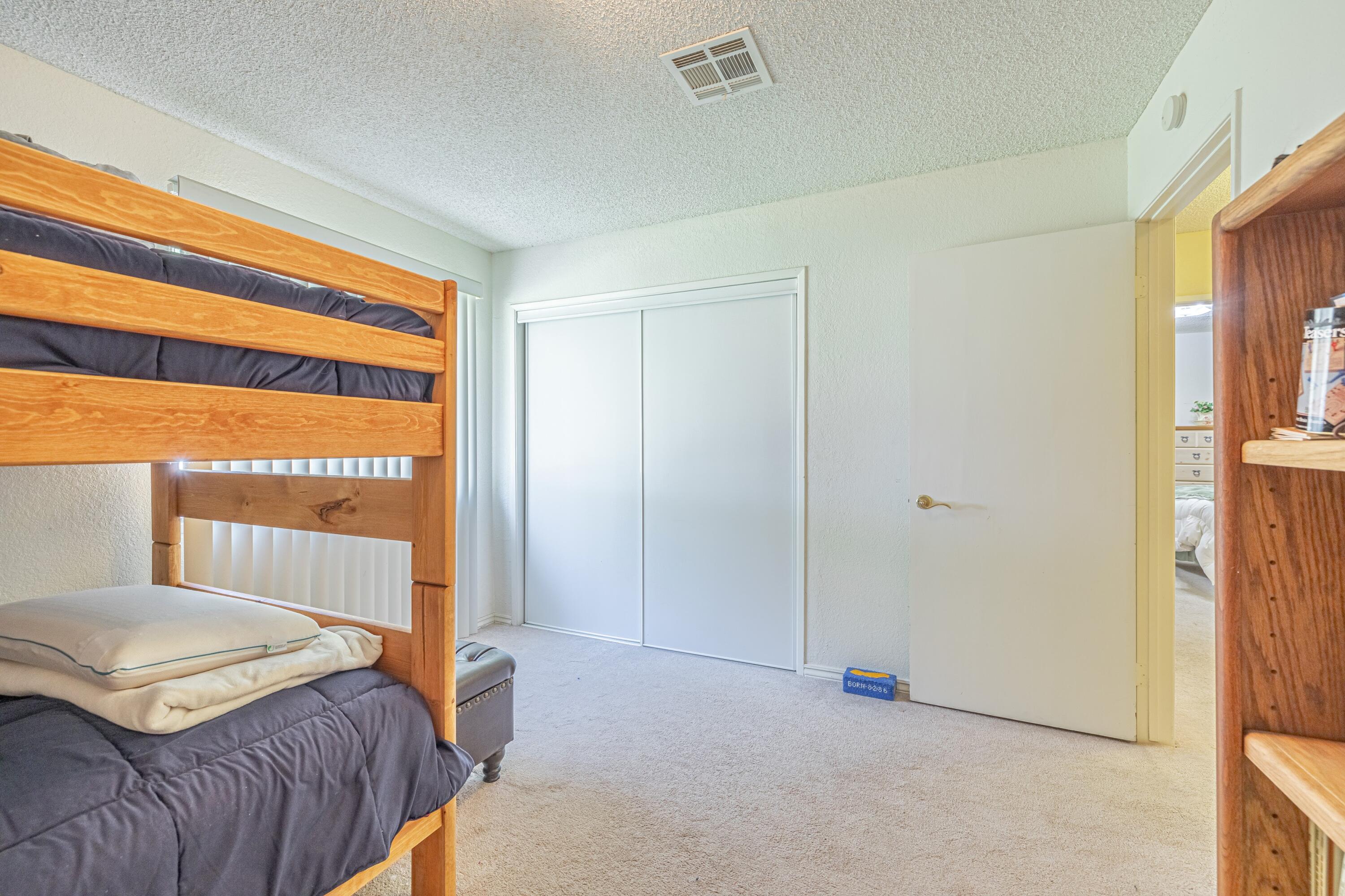 43233 55th Street East Lancaster, CA 93535 - Photo 25 of 46 a bedroom with a bed and a window