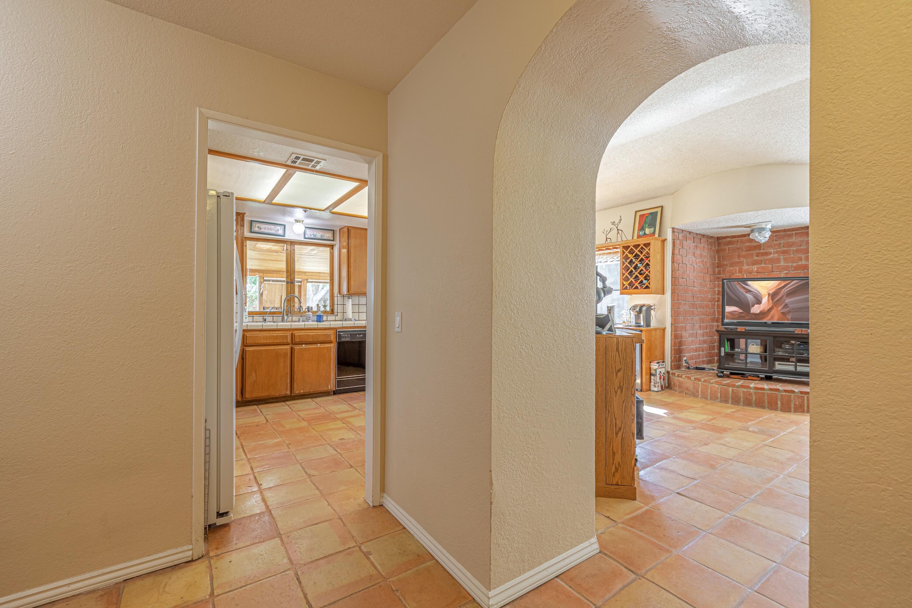 43233 55th Street East Lancaster, CA 93535 - Photo 31 of 46 a view of a livingroom with a kitchen and a sink