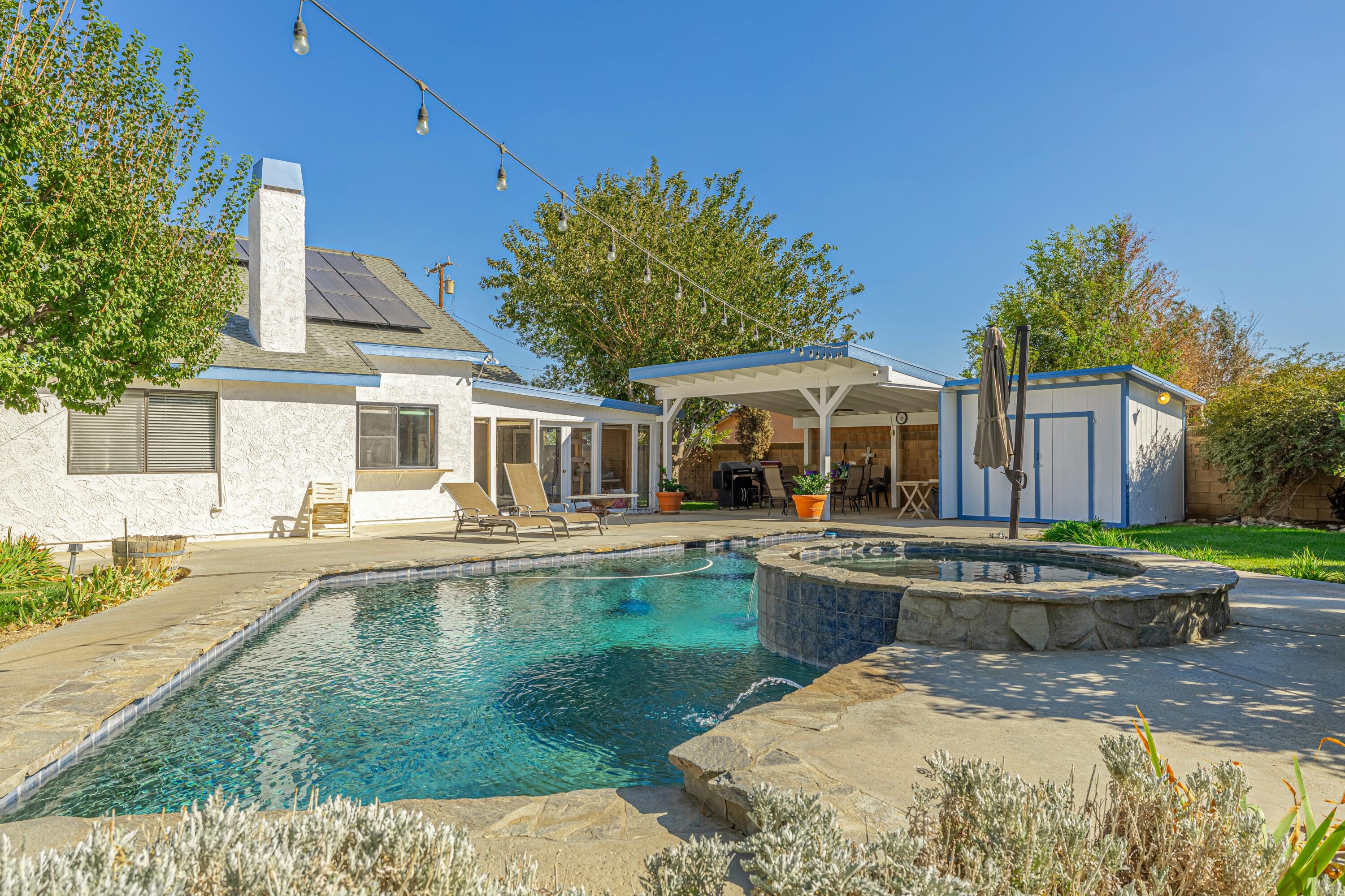 43233 55th Street East Lancaster, CA 93535 - Photo 37 of 46 a front view of house with yard and outdoor seating