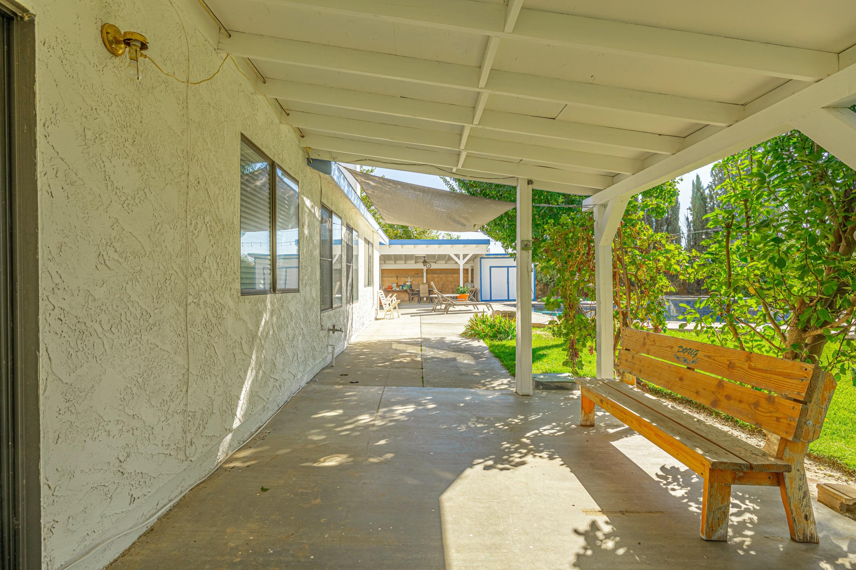 43233 55th Street East Lancaster, CA 93535 - Photo 38 of 46 a view of a porch with furniture and a backyard