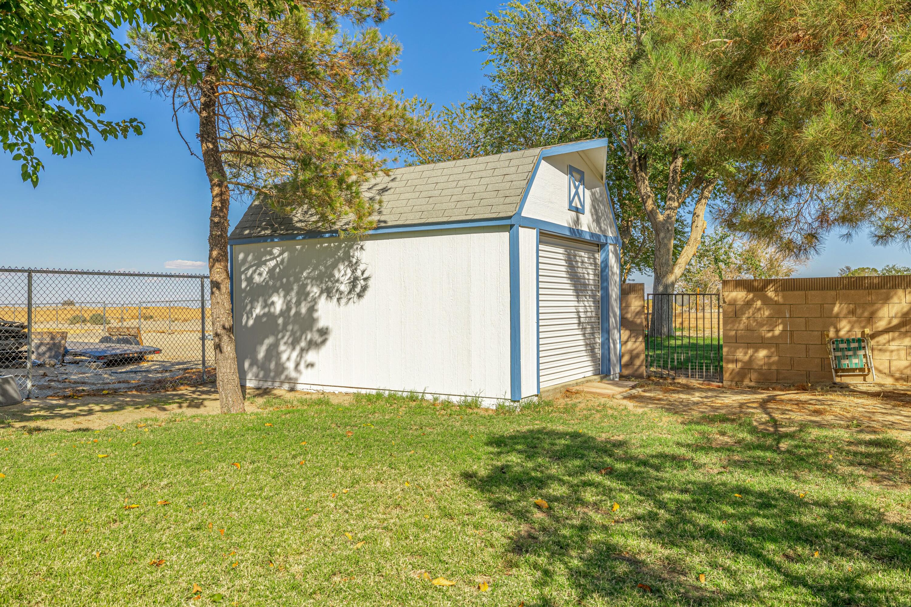 43233 55th Street East Lancaster, CA 93535 - Photo 41 of 46 a view of a house with a yard