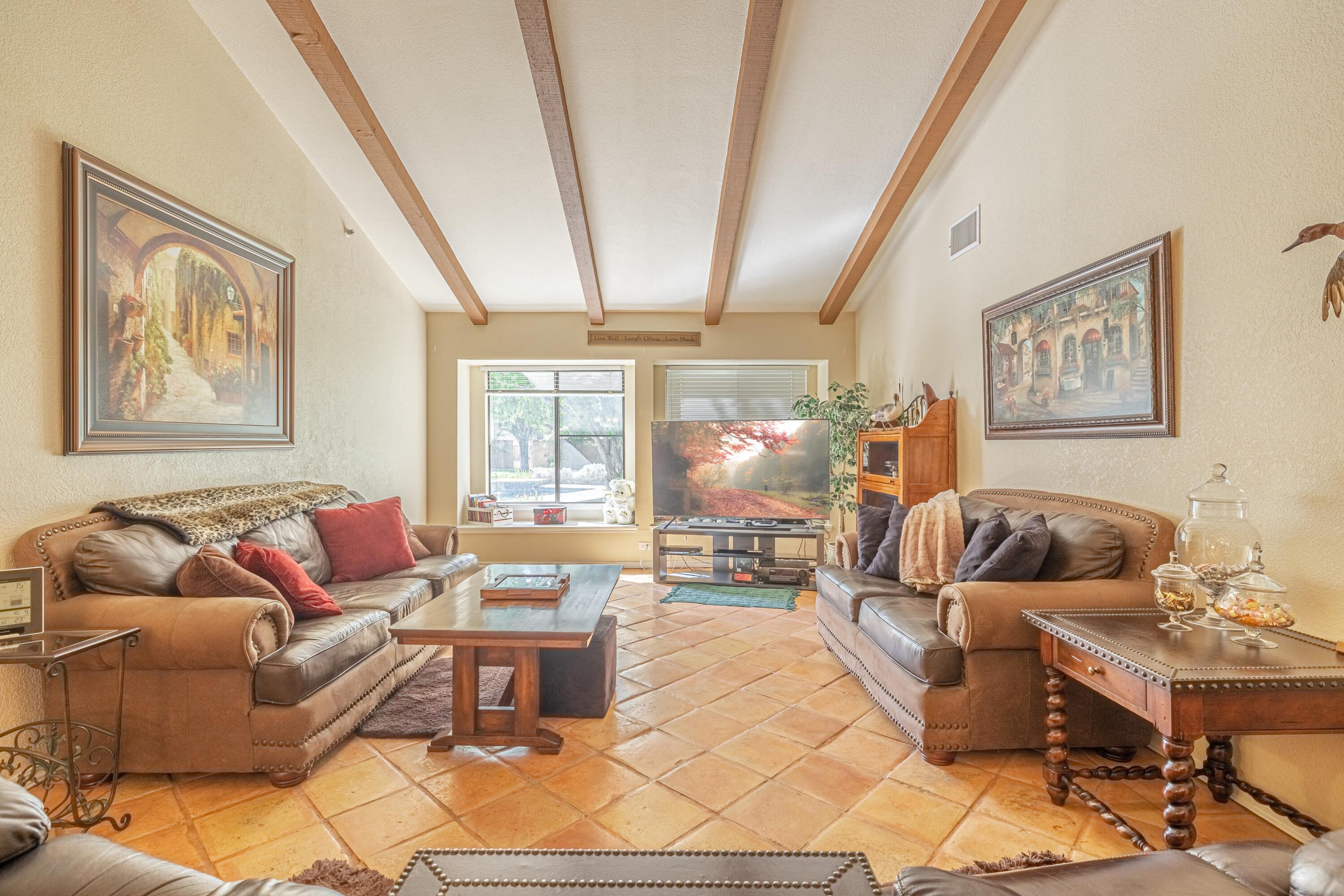 43233 55th Street East Lancaster, CA 93535 - Photo 6 of 46 a living room with furniture and a large window