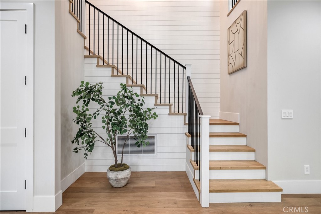 1820 9th Street Manhattan Beach, CA 90266 - Photo 24 of 75 a view of staircase with wooden floor and a potted plant