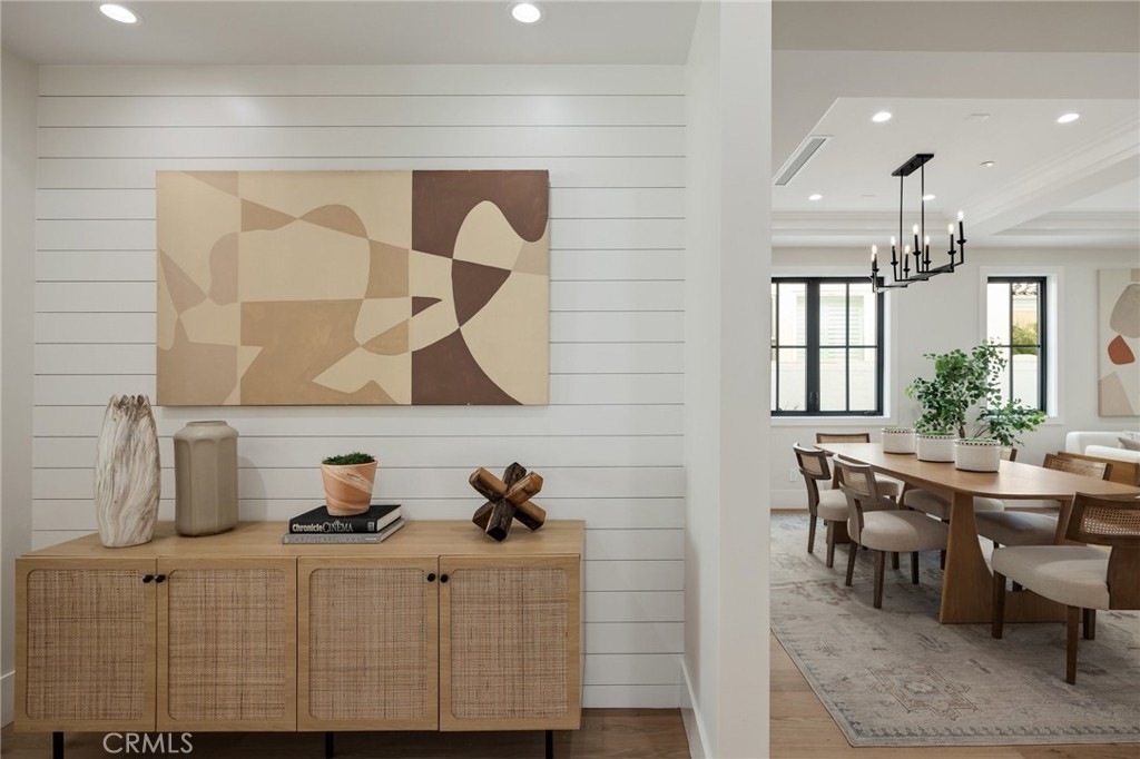 1820 9th Street Manhattan Beach, CA 90266 - Photo 25 of 75 a kitchen with stainless steel appliances wooden floor and table chairs