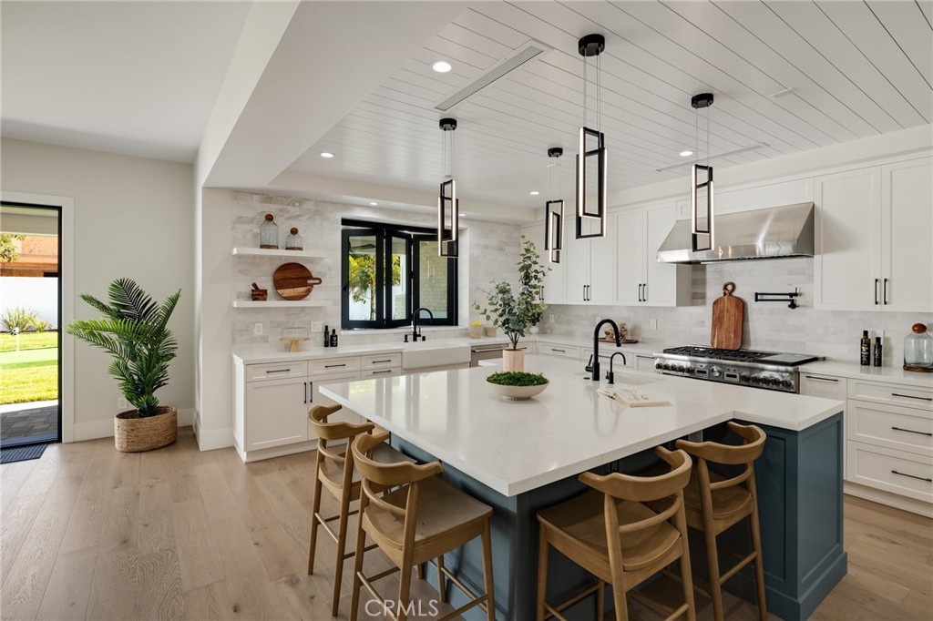 1820 9th Street Manhattan Beach, CA 90266 - Photo 35 of 75 a kitchen with a table and chairs in it