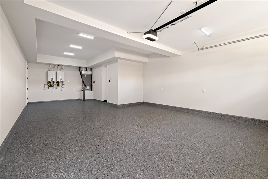 1820 9th Street Manhattan Beach, CA 90266 - Photo 49 of 75 an empty room with a ceiling fan and windows