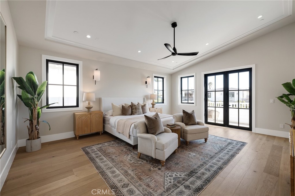 1820 9th Street Manhattan Beach, CA 90266 - Photo 51 of 75 a spacious bedroom with a bed couch and windows