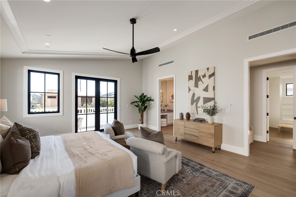 1820 9th Street Manhattan Beach, CA 90266 - Photo 52 of 75 a bedroom with a large bed and a chandelier