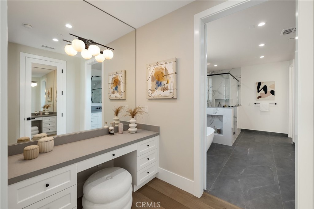 1820 9th Street Manhattan Beach, CA 90266 - Photo 55 of 75 a spacious bathroom with a granite countertop sink mirror and shower