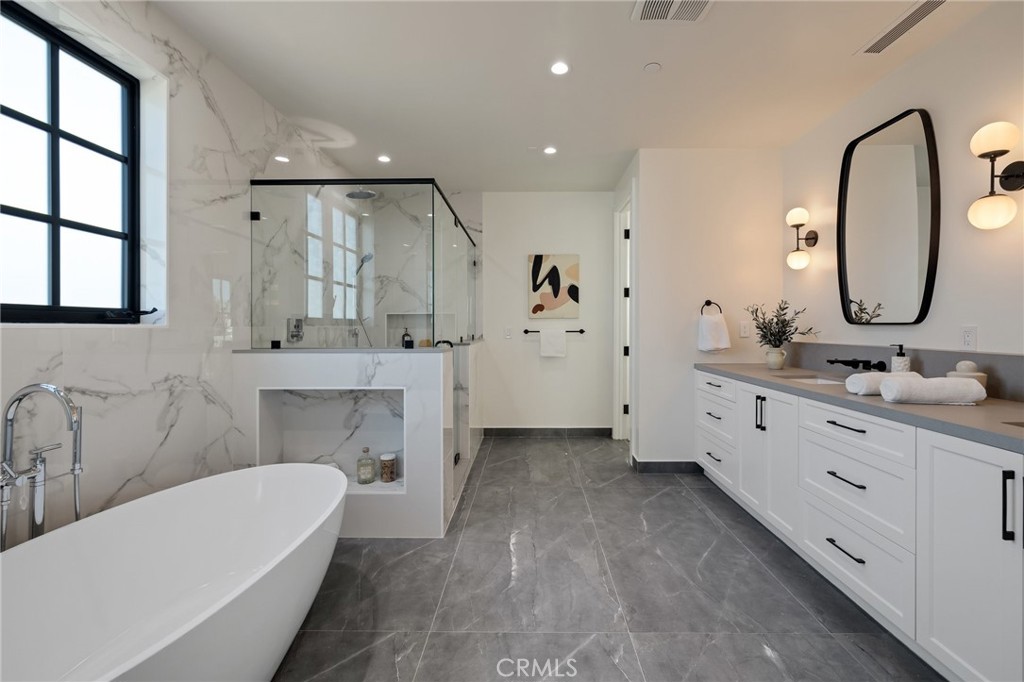 1820 9th Street Manhattan Beach, CA 90266 - Photo 56 of 75 a bathroom with a double vanity sink mirror and bathtub