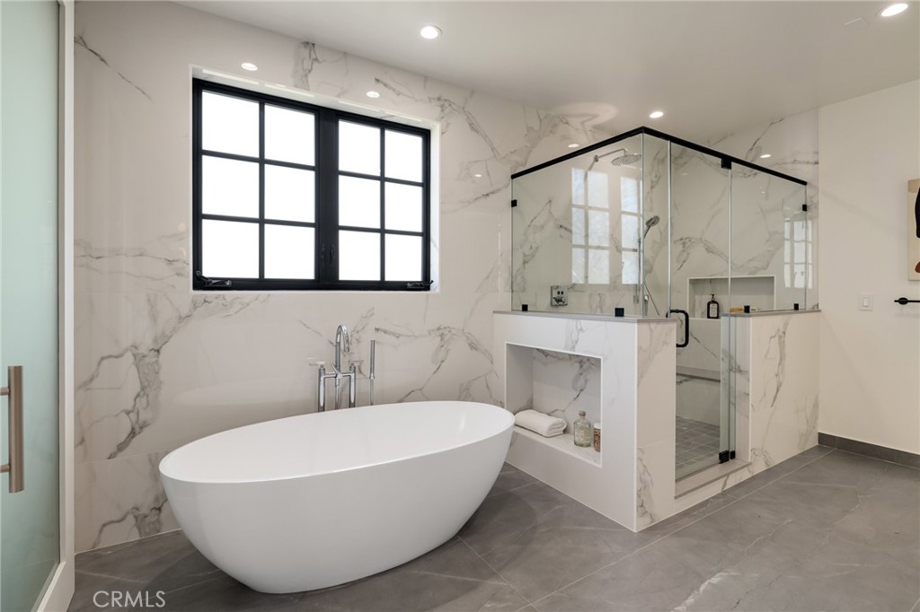1820 9th Street Manhattan Beach, CA 90266 - Photo 60 of 75 a bathroom with a white tub and shower