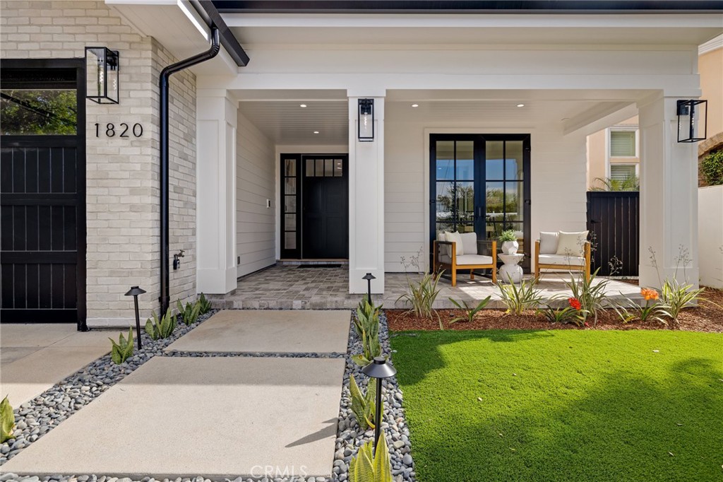 1820 9th Street Manhattan Beach, CA 90266 - Photo 6 of 75 a front view of a house with a yard