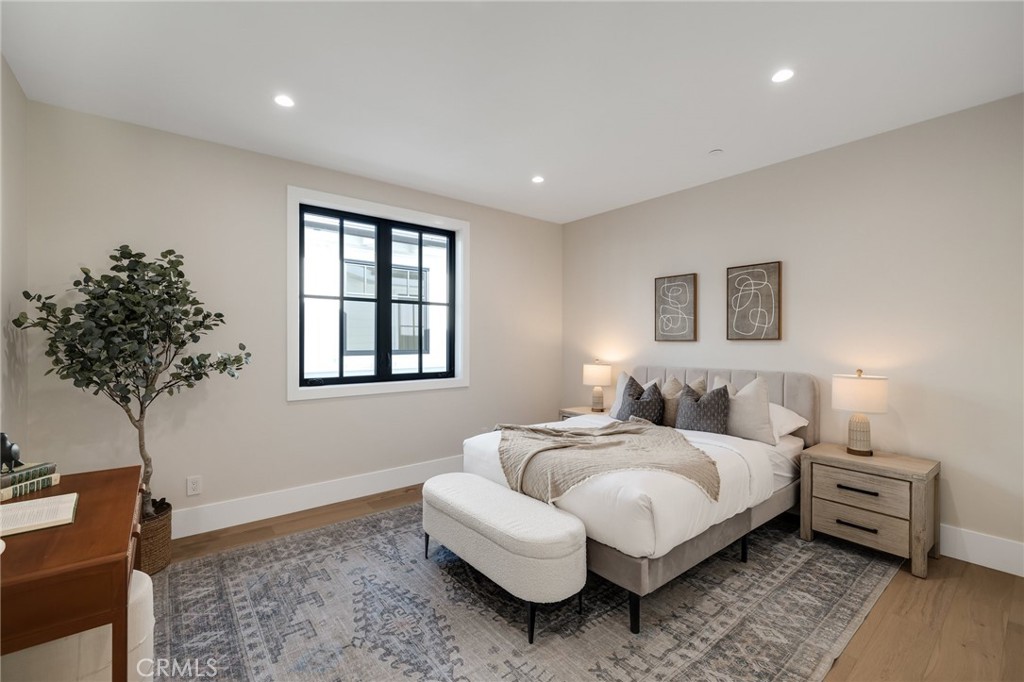1820 9th Street Manhattan Beach, CA 90266 - Photo 63 of 75 a bedroom with furniture and a potted plant